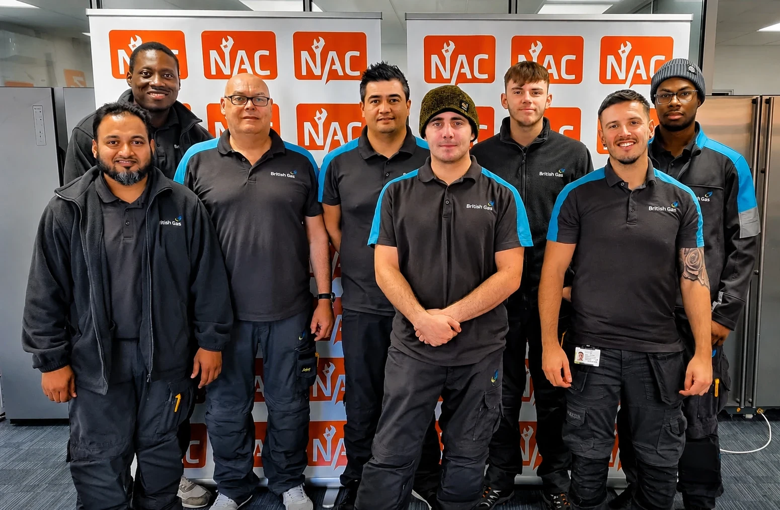 British Gas engineers with the NAC team in front of NAC banners